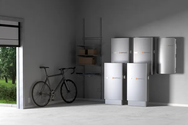 Multiple Enphase home battery storage units mounted on a garage wall, representing solar battery systems eligible for the Maryland RCES grant